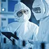 Factory Cleanroom: Engineer and Scientist Wearing Coveralls, Standing in Workshop Talk and Use Tablet Computer, Professionals Develop Technology for Modern CNC Machinery and Electronic Equipment