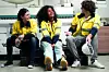 Break time. Group of diverse engineer people sitting together take a break and talking. Young multiracial woman and colleagues technician relax after job in factory. Manufacturing employee lifestyle.