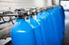 Oxygen cylinder with compressed gas. Blue Oxygen tanks for industry. Liquefied oxygen production. Factory