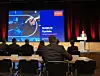 Felix Hanisch von Bayer eröffnet auf der Bühne in der Stadthalle Neuss die Namur Hauptsitzung 2023; Automatisierung, Digitalisierung, Schneider Electric,
