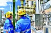 chemical industry plant - workers in work clothes in a refinery