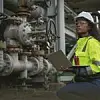 Engineers or industrial worker at large metal pipelines and valv