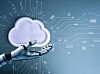Robot hand holding white cloud icon with circuit board background, symbolizing AI cloud technology, artificial intelligence, cloud computing, automation, data storage, and digital transformation.