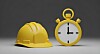 Gelber Bauhelm neben gelber Stoppuhr auf grauem Hintergrund.