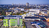 Luftaufnahme des Evonik-Standorts Goldschmidtsraße in Essen mit Campusgebäude und Industrieanlagen.